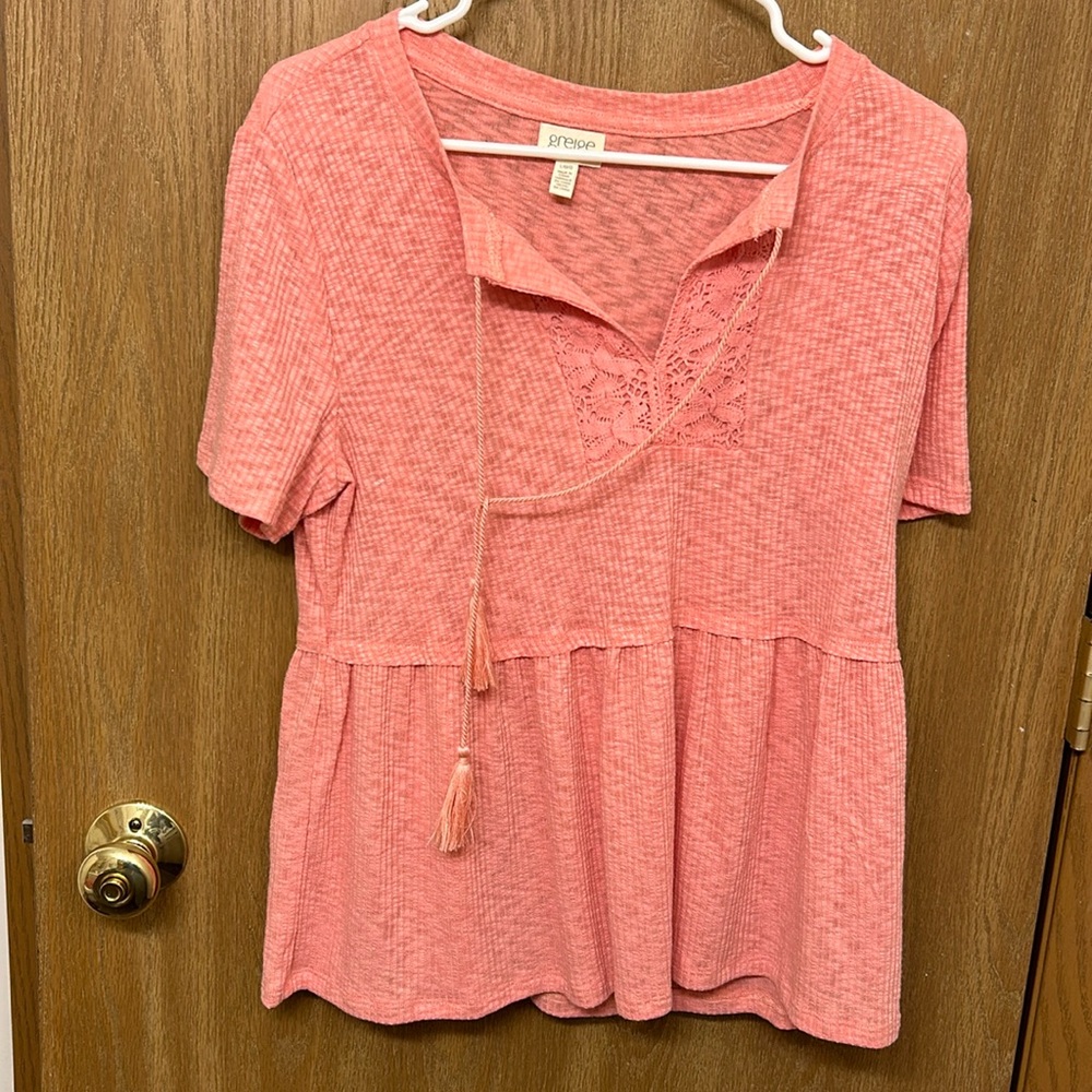 Pink t - shirt with cute neckline.